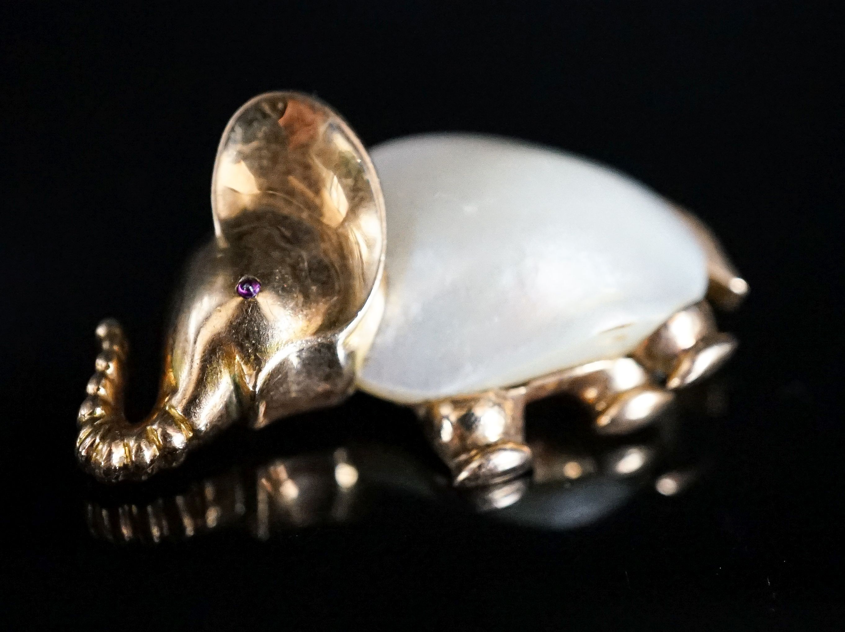 A 20th century Viennese 585 yellow metal, mother of pearl and cabochon set brooch, modelled as an elephant, 36mm, gross weight 10 grams.